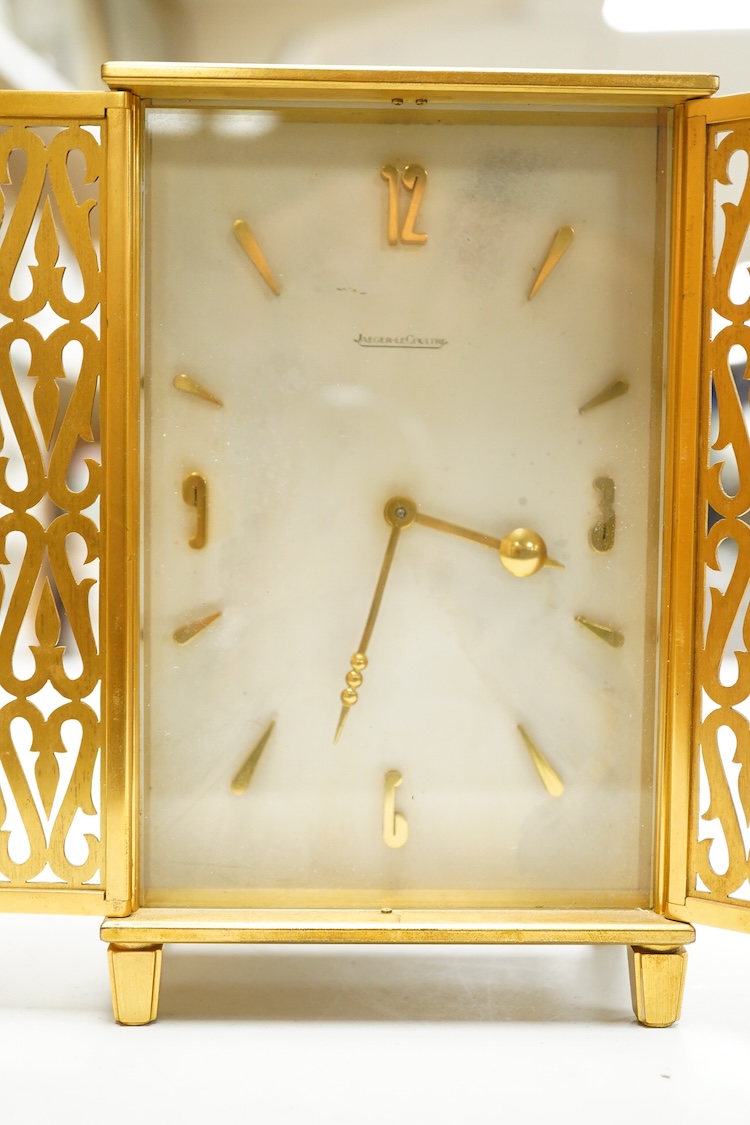 A Jaeger LeCoultre timepiece in the form of a wardrobe with pierced doors, one leg missing, 16cm high